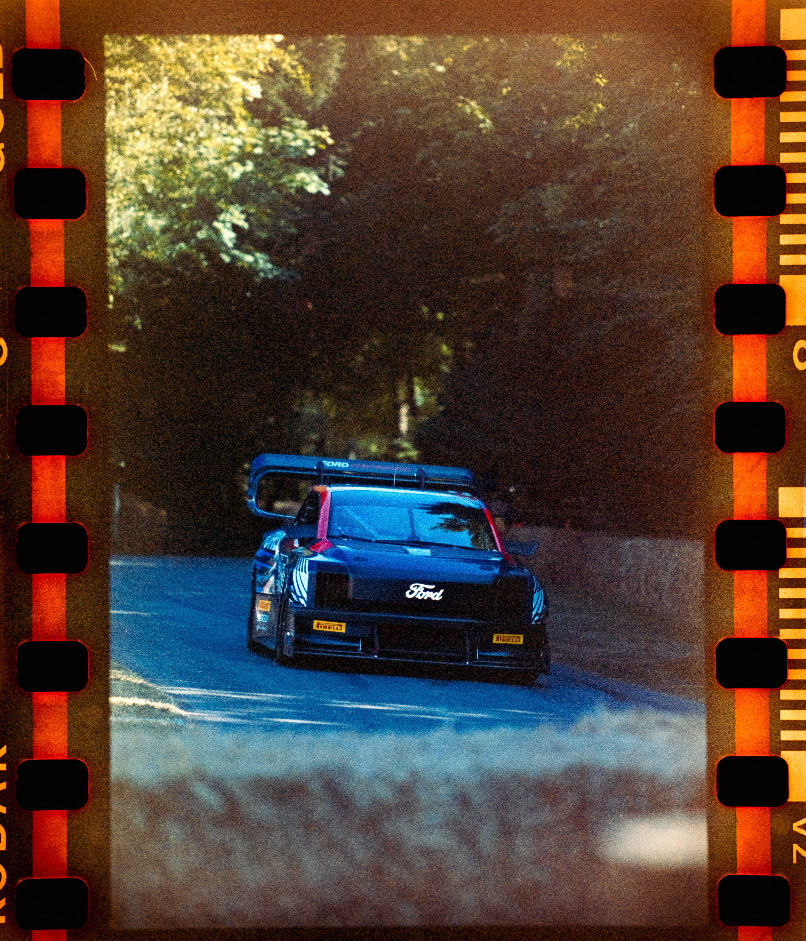 This image of the SuperTruck was shot on a long-expired roll of colour film. You can see the intense grain and colour shift caused by the age of the film. I decided to scan this with the borders included because I think the oranges and the reds complement the colours of the vehicle. The light has made the Ford script on the front really pop. This was the last photo I took on the day, which is nice because the faded quality and the film borders make it feel like a warm memory, which one of my favourite things about shooting expired film. License valid for earned editorial, press releases, press kits. All non-broadcast digital and online media Region: Global. This content is solely for editorial use and for providing individual users with information. Any storage in databases, or any distribution to third parties within the scope of commercial use, or for commercial use is permitted with written consent from Ford in Europe GmbH only.